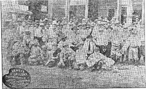 Scouts in front of newspaper office